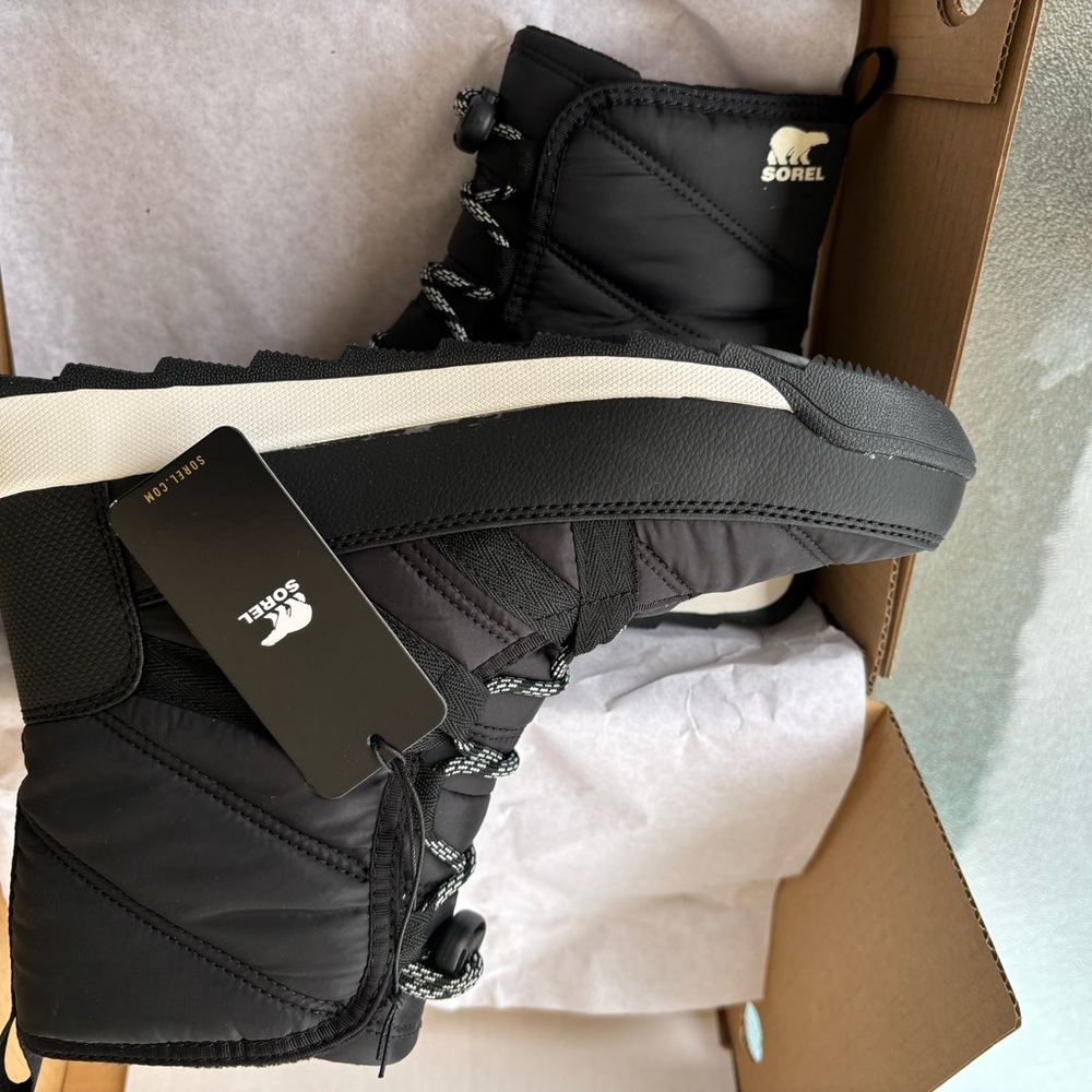 Black and white men’s shoes still in the box